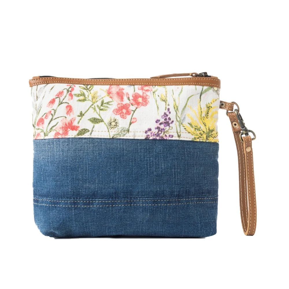 Myra Dahlia Denim Clutch bag with blue  floral canvas, leather trim, and wrist strap back view 