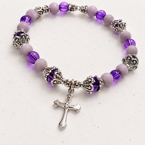 Purple and gray beaded stretch bracelet with silver-toned spacers and stainless steel cross charm